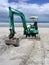 Earthmoving equipment: excavator on beach - front