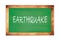 EARTHQUAKE text written on green school board