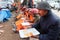 Earthquake victim man and rescue team eating lunch