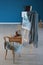 Easel with abstract painting and artist\'s supplies in workshop