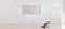 Easel with canvas in bright white room with blank horizontal frame for mockup. Artist workspace . Empty bright room