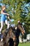 East Anglia Equestrian Fair Horse gymnastic woman standing on two horses