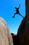 East coast tasmania skeleton bay male jumps from rock to rock