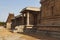 The east gopura in the distance and the side, north, entrance to the ardha-mandapa, Pattabhirama Temple, Hampi, Karnataka. View fr