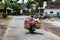 EAST JAVA, INDONESIA JANUARY 2017: Scooter driver transports local fruit to market