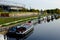 East London, UK: Olympic Stadium and canal with canal boats, Hackney Wick, Stratford.