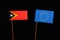 East Timorese flag with European Union EU flag on black
