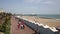 Eastbourne UK with people walking on the seafront promenade