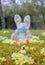 Easter 2021 concept during Coronavirus COVID-19 worldwide pandemic with Easter bunny wearing a medical mask and colorful spring