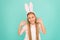 Easter activities. Cute bunny. Holiday bunny girl posing with cute long ears. Child smiling play bunny role. Happy