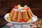 Easter almond ring cake on wooden table