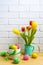 Easter arrangement with tulips in the mint green pitcher