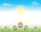Easter Background with Blue Skies and Easter Eggs decorated in the green grass