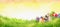 Easter background with bunny, eggs and flowers on grass and sunny sky with bokeh, banner