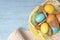 Easter background with colored eggs and cookies, empty place for text