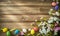 Easter background with colorful eggs and spring flowers