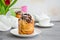 Easter background. Easter cake - Cruffin, Kraffin or Kulich with chocolate nut cream and sugar glaze on top