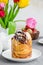 Easter background. Easter cake - Cruffin, Kraffin or Kulich with chocolate nut cream and sugar glaze on top