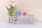 Easter background. Pink flowers tulips. bright colored eggs