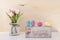 Easter background with wooden plaque with the inscription in English `Easter Blessing`. Bright colored eggs
