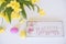 Easter background with wooden plaque with the inscription in English `Easter Blessing`. Bright colored eggs