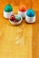 Easter basic set of colored quail eggs green, blue and red mini quail with copy space on wooden background