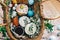 Easter basket with eggs, easter bread,ham,sausage, butter with flowers and branches on cloth on rustic wooden background. Happy