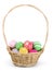 Easter basket filled with colorful eggs on a white