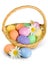 Easter basket filled with colorful eggs on a white