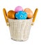 Easter basket filled with colorful eggs on a white