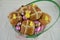 Easter basket gift filled with chocolate eggs and hot cross buns