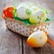 Easter basket on wooden board