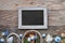 Easter black board with Easter eggs, flowers and spring decorations on rustic wood, text \\\