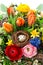 easter bouquet with egg decoration. spring flowers tulip, ranunculus, hyacinth