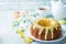 Easter Bundt cake with colorful topping and Easter Cookies