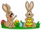 Easter bunnies playing with easter eggs