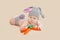 Easter bunny baby playing with carrot