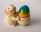 Easter bunny with a basket with painted colorful egg