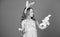 The Easter bunny is coming. Easter bunny rabbit. Little girl and rabbit toy. Small girl in rabbit ears with Easter toy