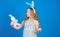 The Easter bunny is coming. Easter bunny rabbit. Little girl and rabbit toy. Small girl in rabbit ears with Easter toy