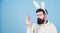 Easter bunny. Having fun. Funny bunny with beard and mustache hold pink egg. Bearded man wear silly bunny ears. Easter