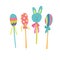 Easter bunny head  and eggs candies on sticks.