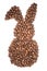 Easter bunny made of freshly roasted coffee beans on a white background.
