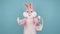 Easter bunny or rabbit or hare holds basket of colored eggs, have fun, dancing, celebrate Happy easter. Easter rabbit