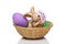 Easter bunny sitting with Easter eggs in basket