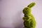 Easter bunny toy coated in green astro turf