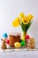 Easter cake, eggs,  rabbit and yellow tulips. Easter composition