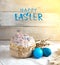 Easter cake on a light background, in a rustic style with blue eggs and beautiful sprigs of willow on a white napkin