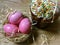 Easter cake paska in straw and the coloured eggs krashanka