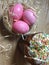 Easter cake paska in straw and the coloured eggs krashanka